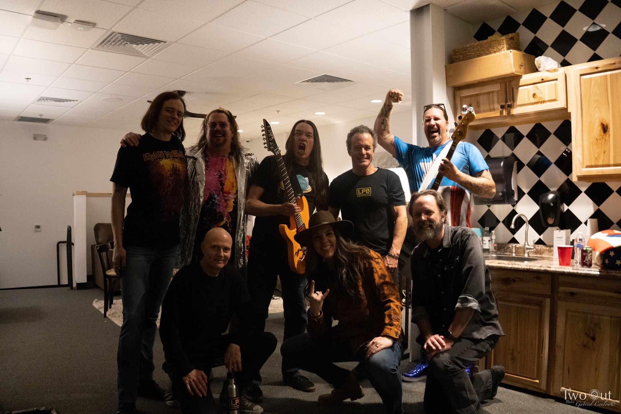 Last Patrol Band and friends backstage at Boot Barn Hall after the show, one in an LPB shirt
