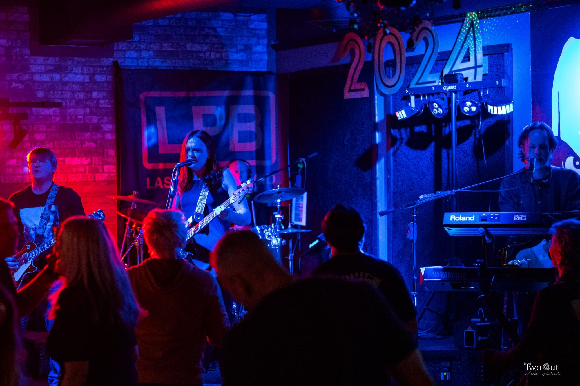 Last Patrol Band performing at Buzzed Crow on New Year's Eve, the crowd dancing right at the foot of the stage