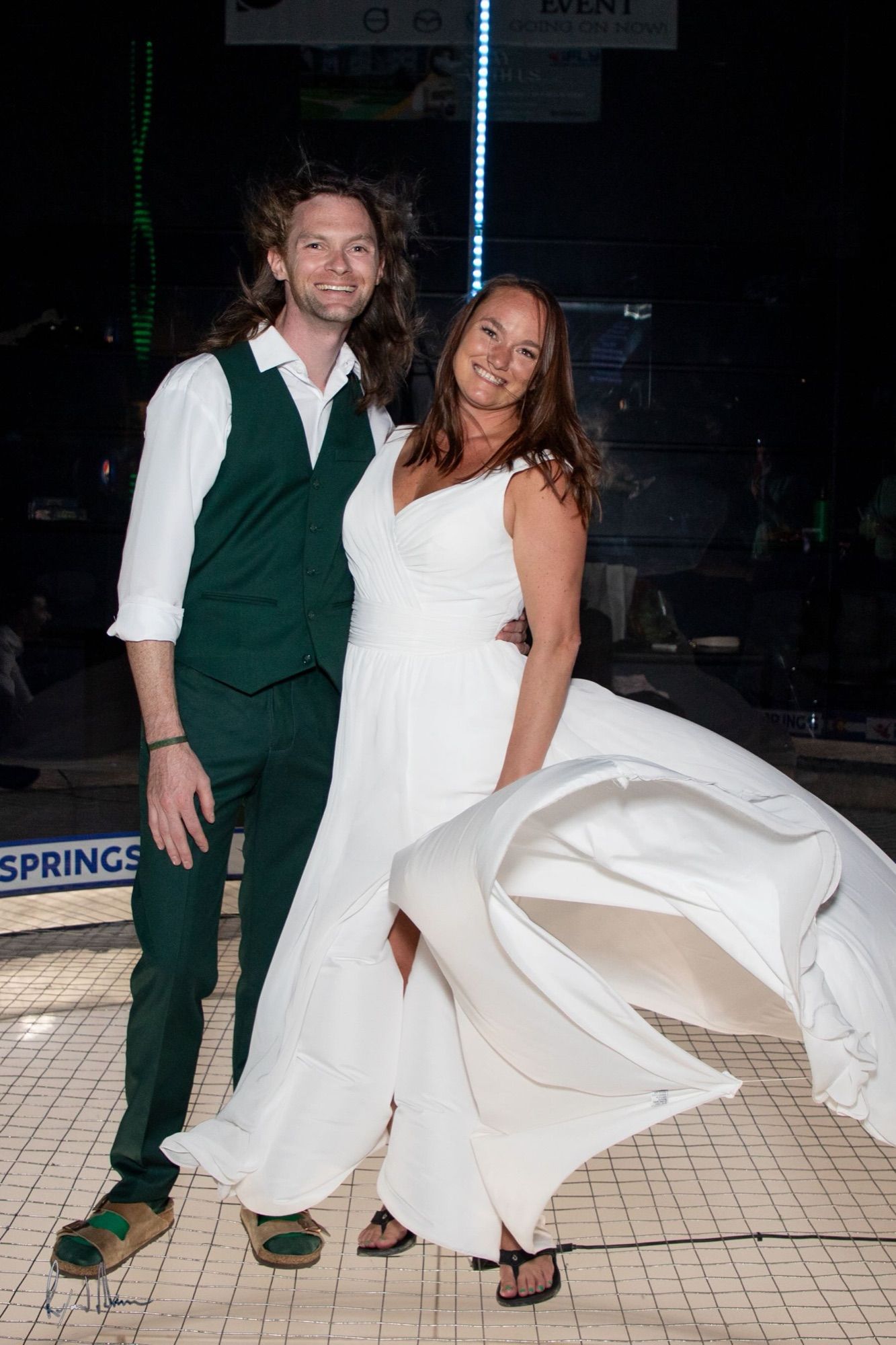 Gabriel and Chelsey in their wedding clothes at the reception