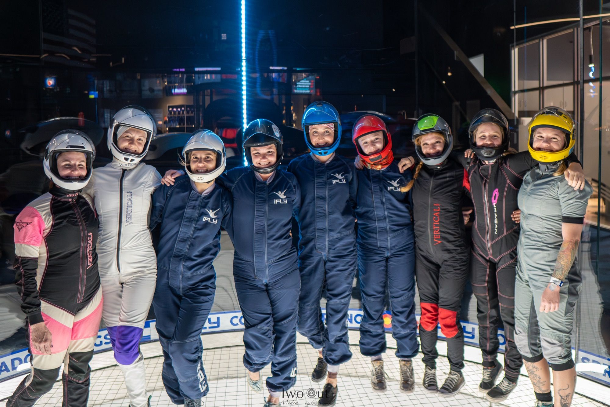 Group of women flyers lined up in the iFly flight chamber after ladies' night