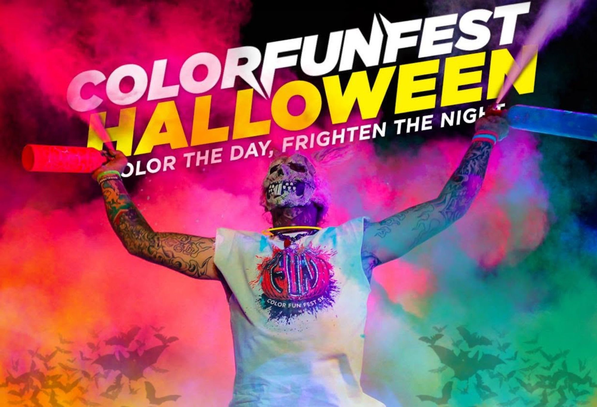 Skull-masked figure holding coloured smoke sticks for a Halloween colour run