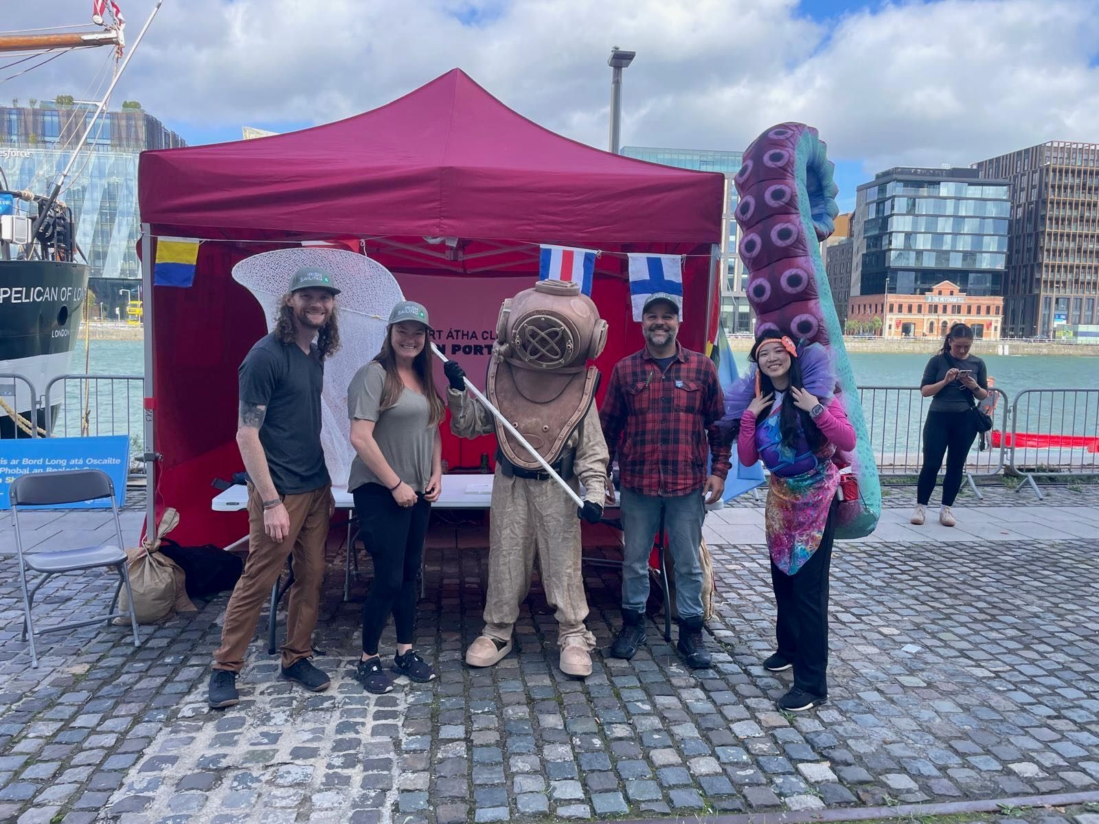 Our crew at an event stand on the Dublin docklands, with a diver costume and a giant tentacle