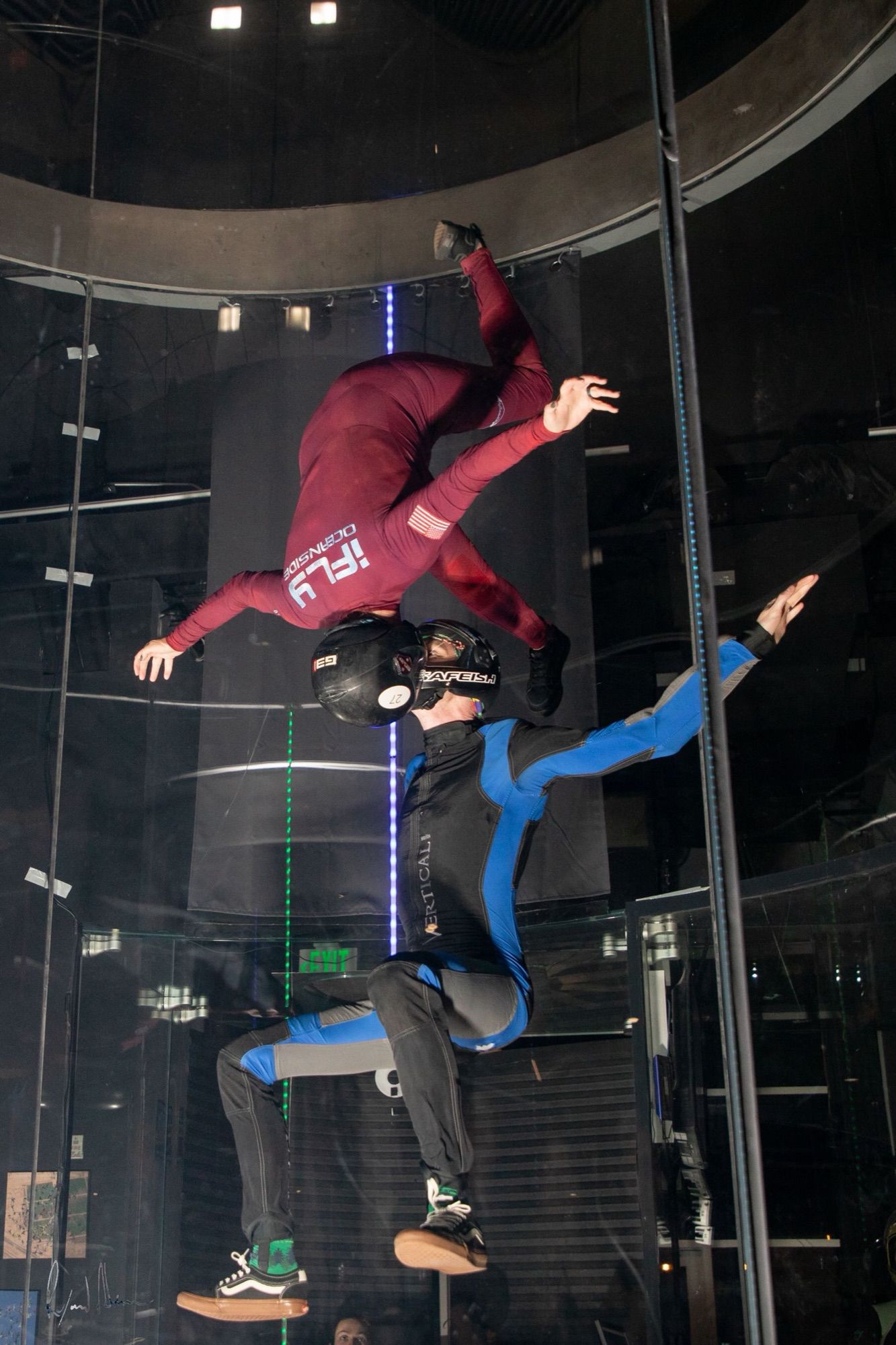 Chelsey flying upside down above Gabriel in the tunnel